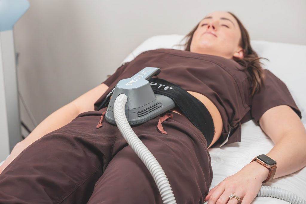 Body sculpting treatment being performed on a patient’s midsection.